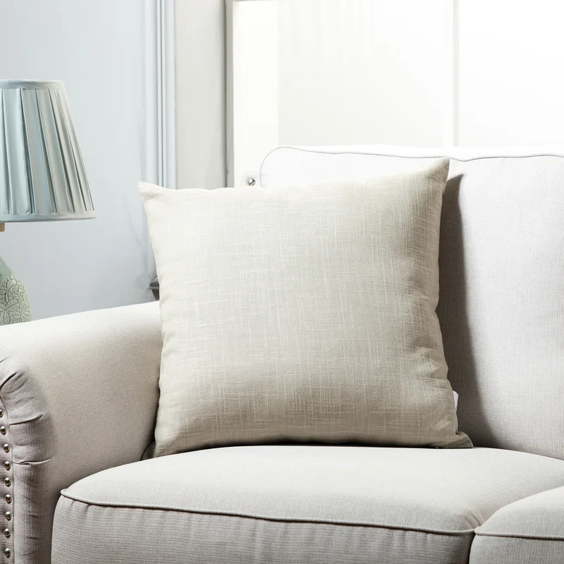 linen throw pillow from Wayfair on a couch 