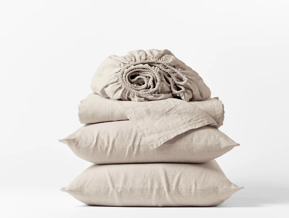 two pillows, a fitted sheet, and a flat sheet from the Coyuchi organic linen sheet set