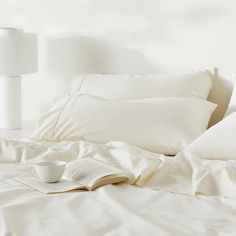Ettitude hemp pillow cases on a bed