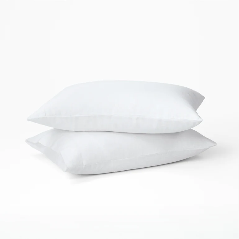 Tuft & Needle hemp pillowcase set on two white pillows