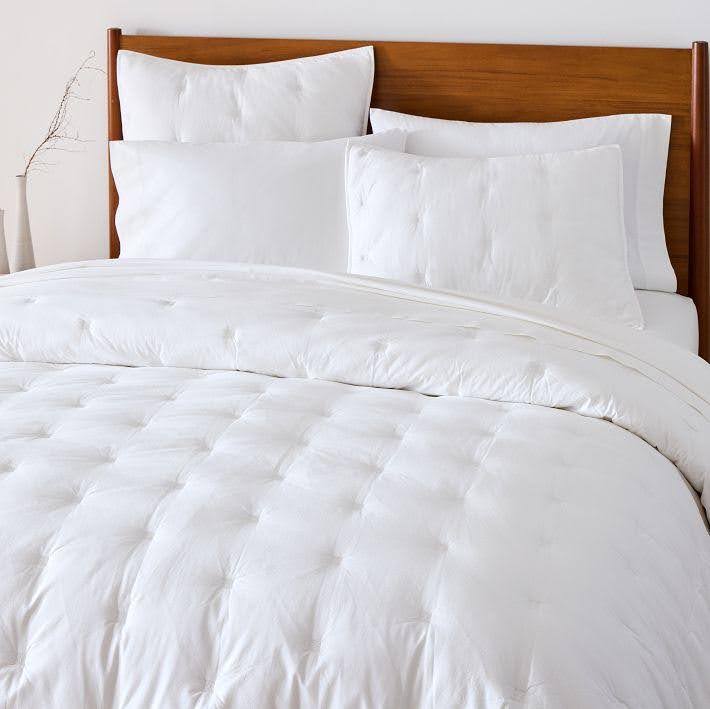 West Elm washed cotton comforter and shams on a bed
