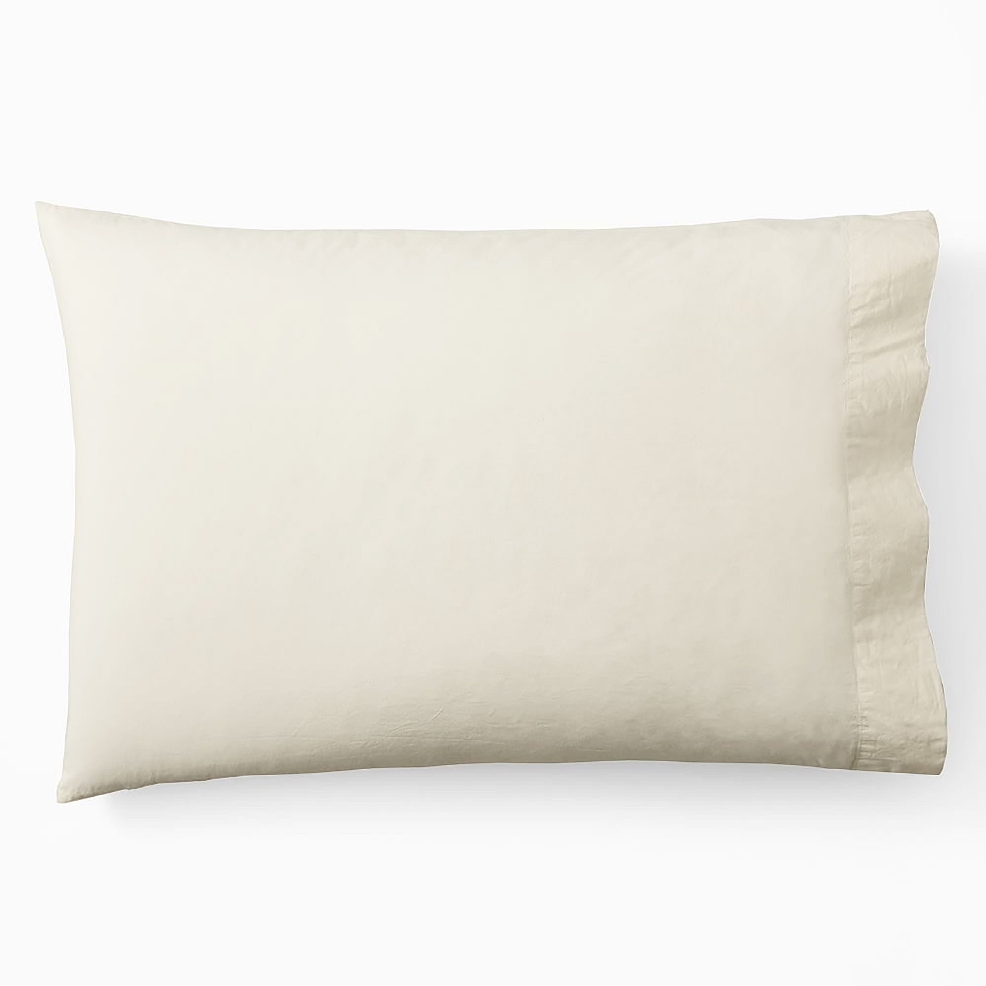 A pillow covered in a beige West elm organic washed cotton pillowcase