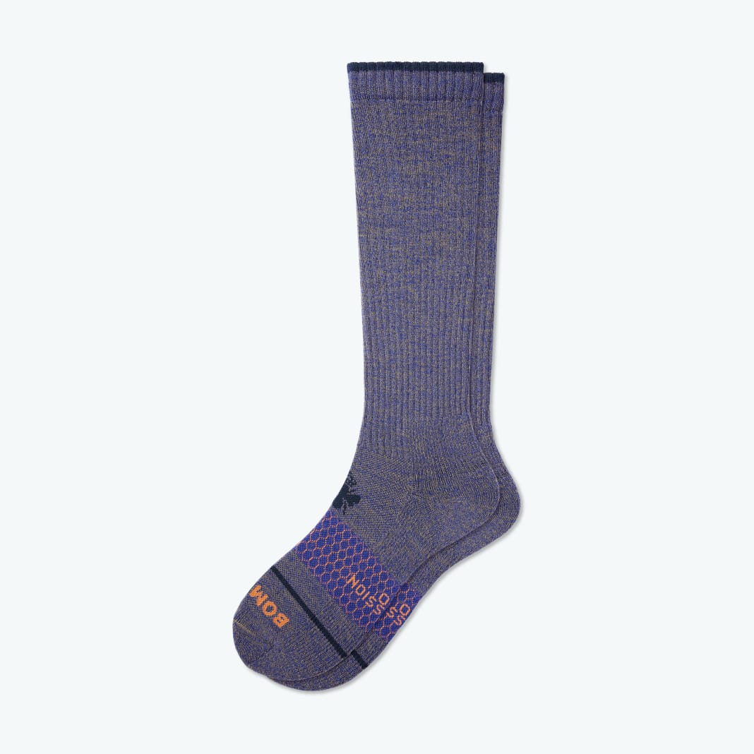 A pair of purple men's wool compression socks from Bombas