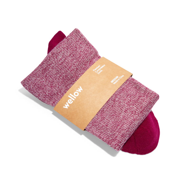 A pair of dark pink and red bamboo compression socks from Wellow