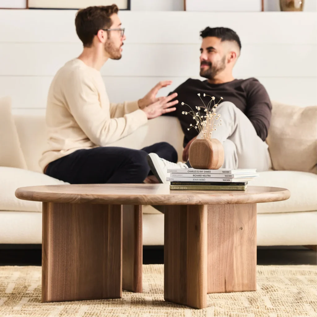 Friends enjoying a cozy chat around their sustainable coffee table