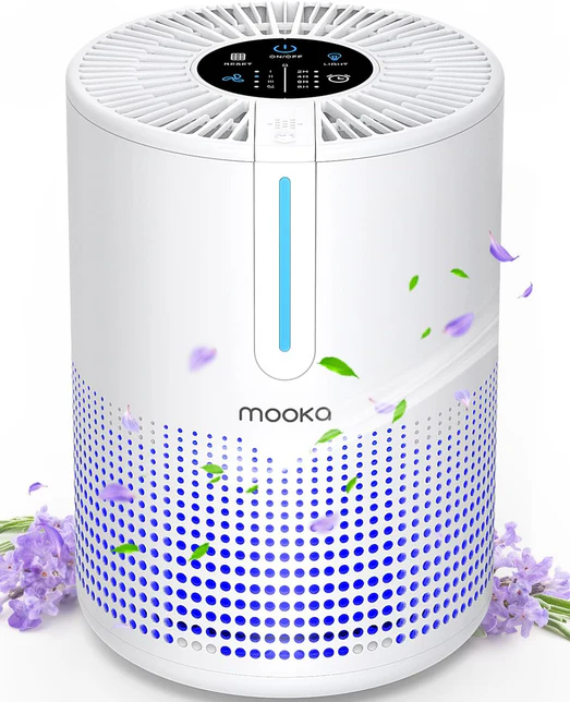 A white Mooka air purifier with a top control panel, purple lights, and lavender decorations surrounding it