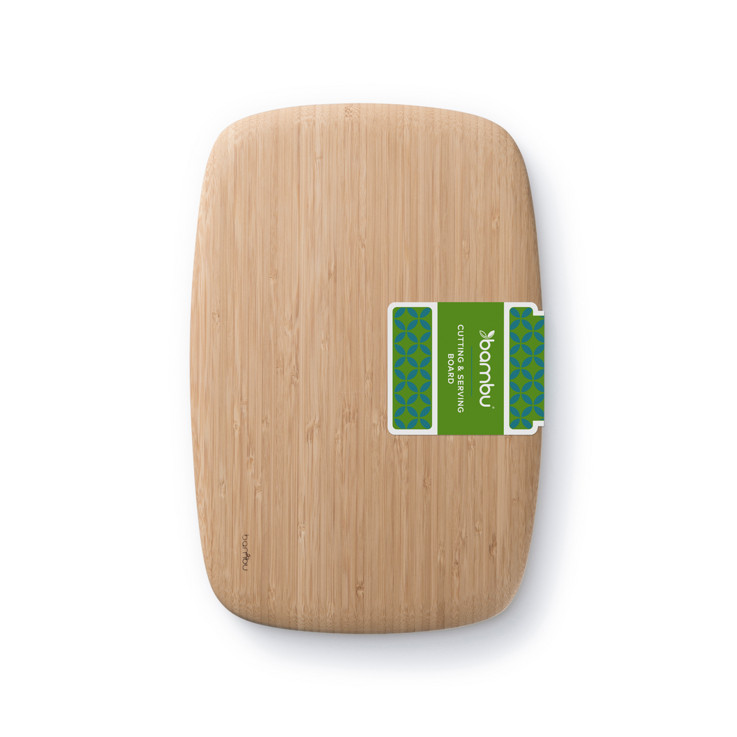 A bamboo cutting and serving board with a smooth, natural finish and a green label featuring the "bambu" logo and design details.