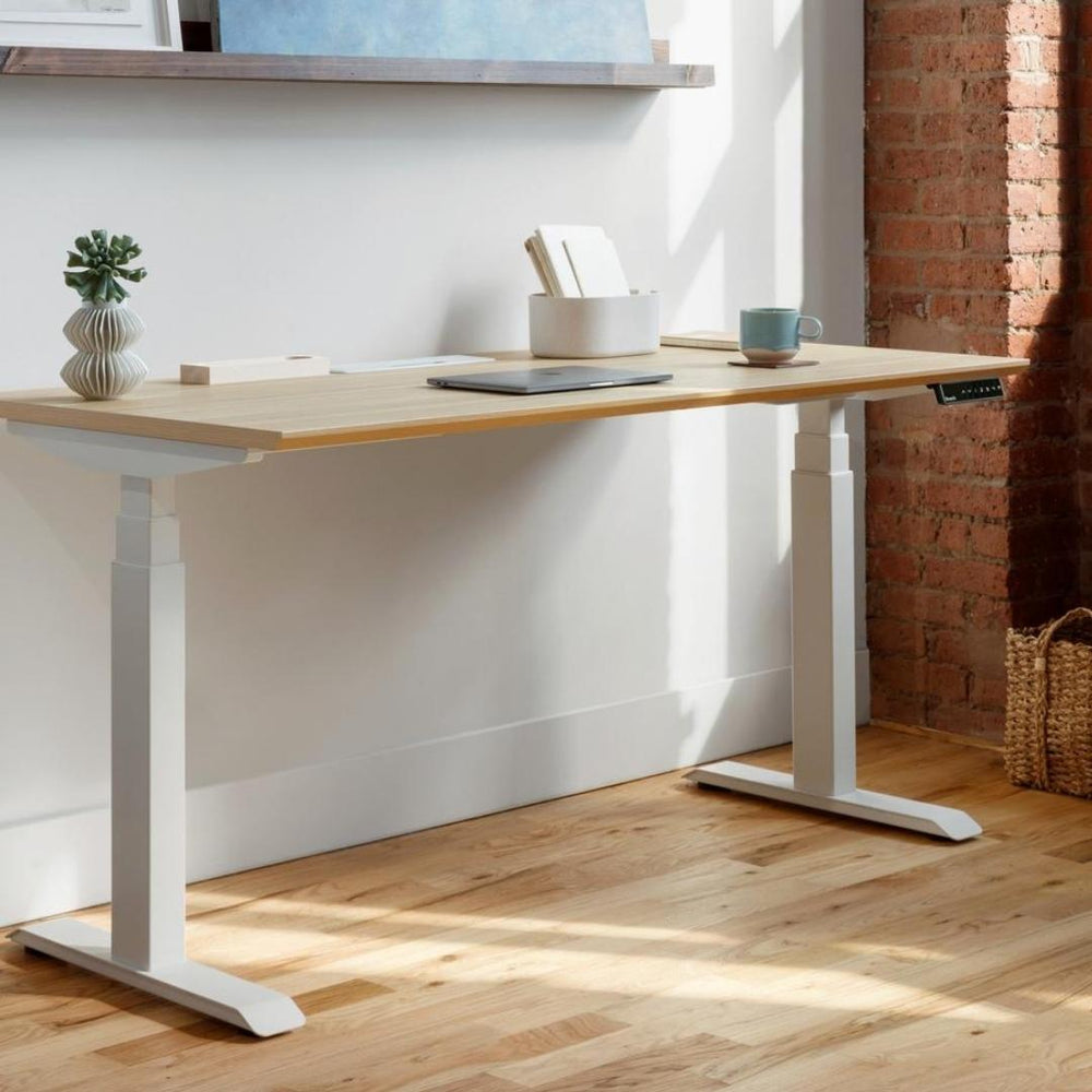 Elevate your workspace sustainably with Branch Furniture's Woodgrain Standing Desk and Office Chair.