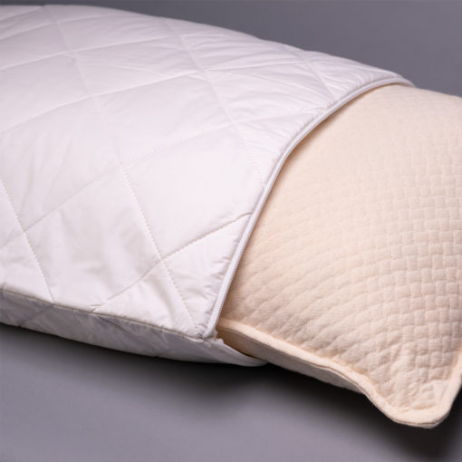 The 45th Street Bedding washable wool pillow cover being put on a pillow insert