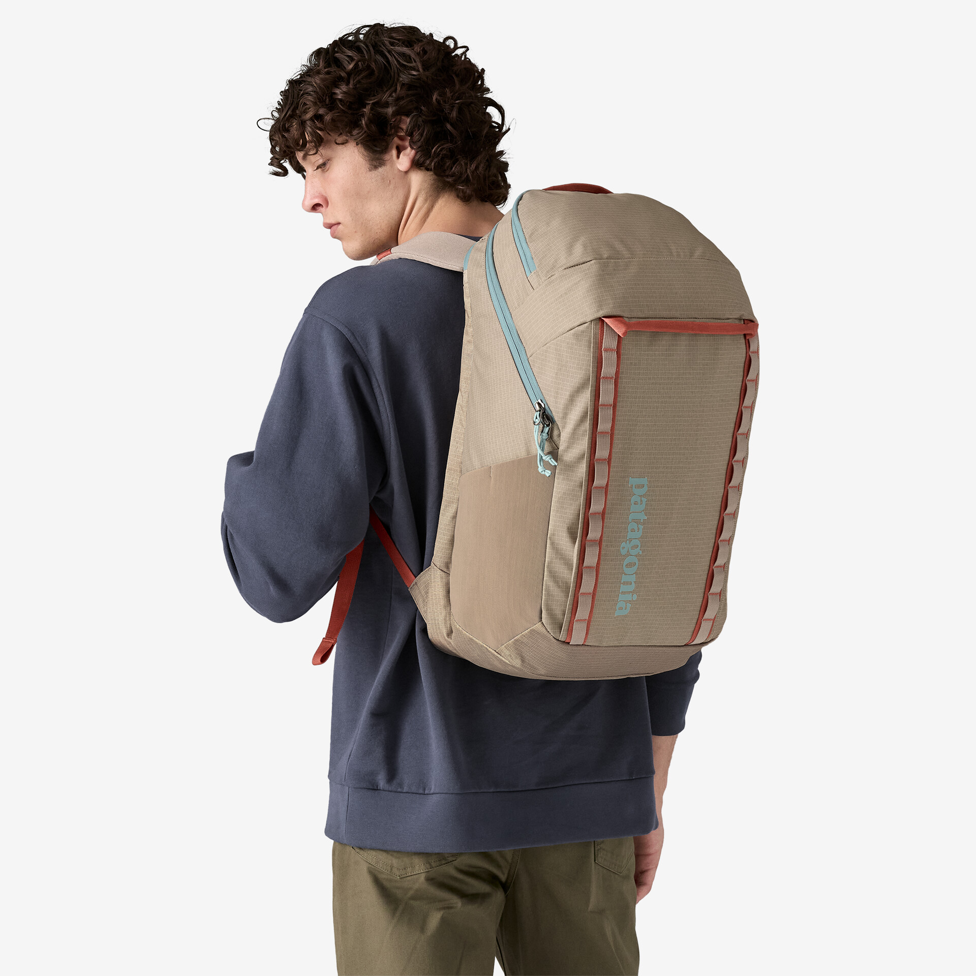 Man wearing Patagonia backpack supporting eco-friendly and ethical causes.