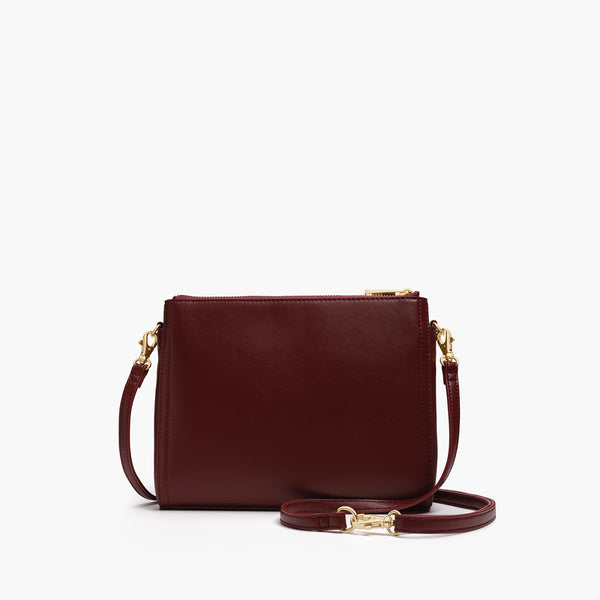 Lo & Sons Pearl Cactus Leather Bag in a sleek design, featuring a cactus leather exterior, adjustable strap, and multiple compartments for versatility.