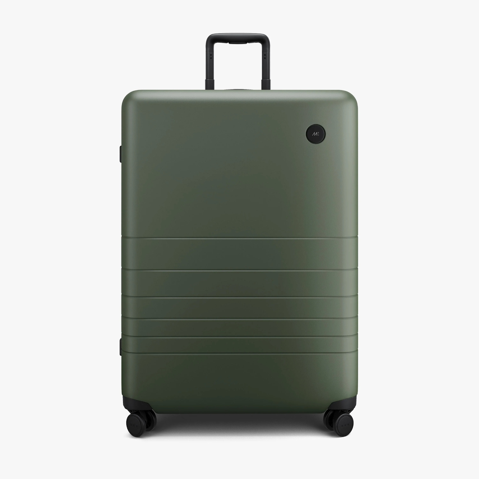 A modern, eco-friendly Monos Check-In Large Suitcase perfect for overnight trips, made with sustainable materials.