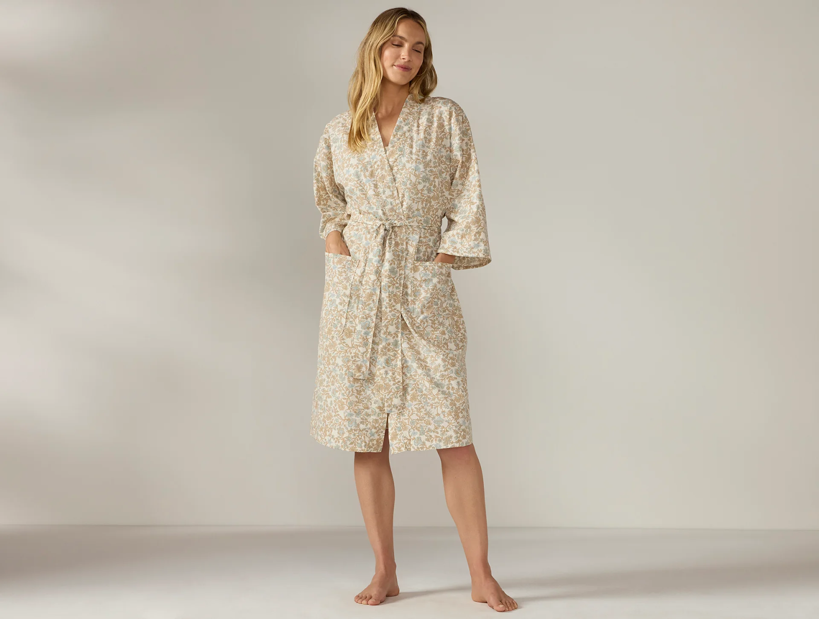 Female wearing a cozy organic cotton robe from Coyuchi, an eco-friendly brand specializing in sustainable loungewear and bedding.