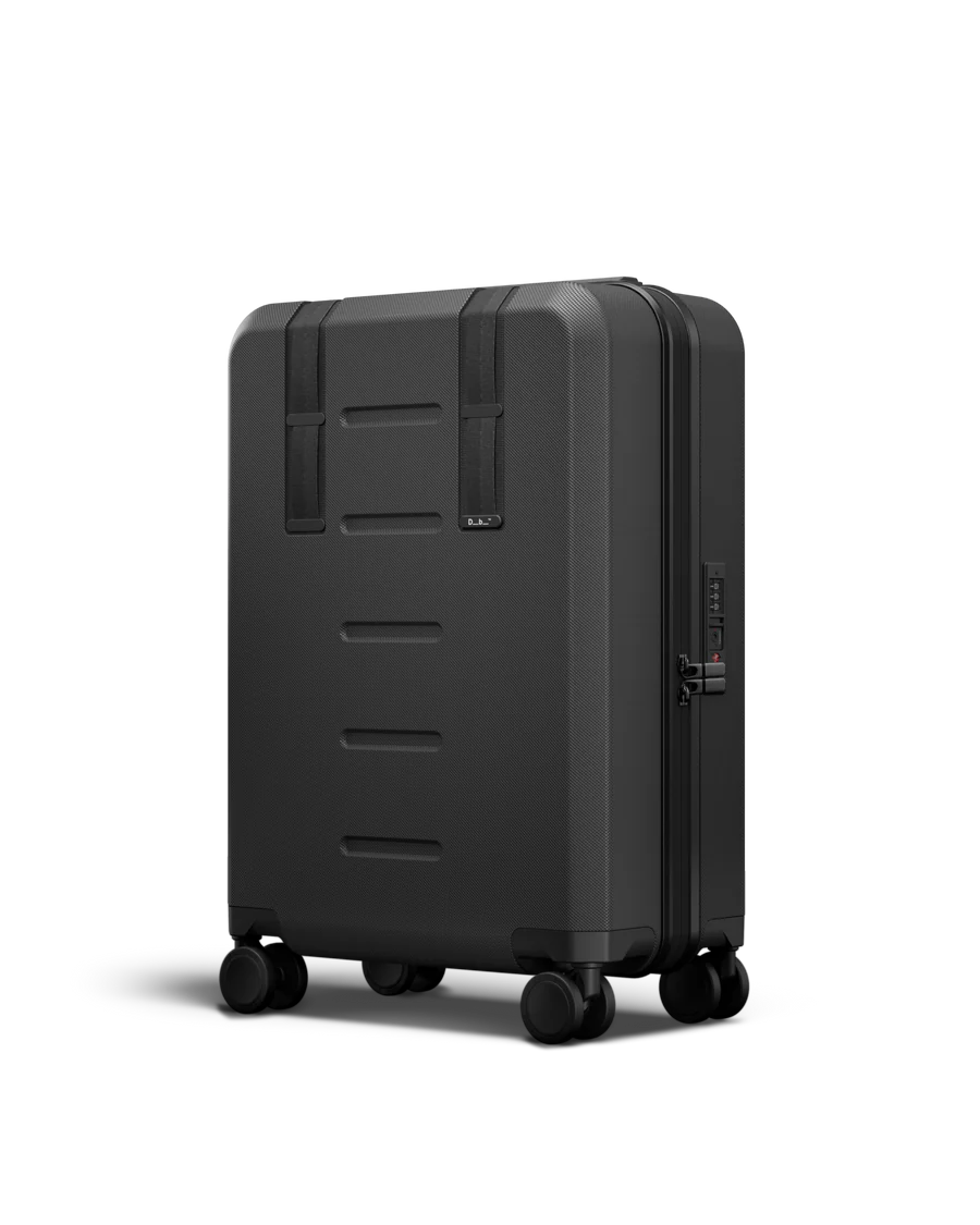 A black Db Ramvert Carry-On Black Out bag made from recycled polyester and polycarbonate, designed for sustainability and durability.
