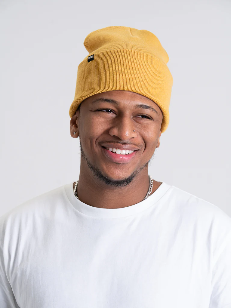 Man wearing a stylish organic cotton t-shirt from Terra Thread, an eco-friendly clothing brand committed to sustainable practices and materials.
