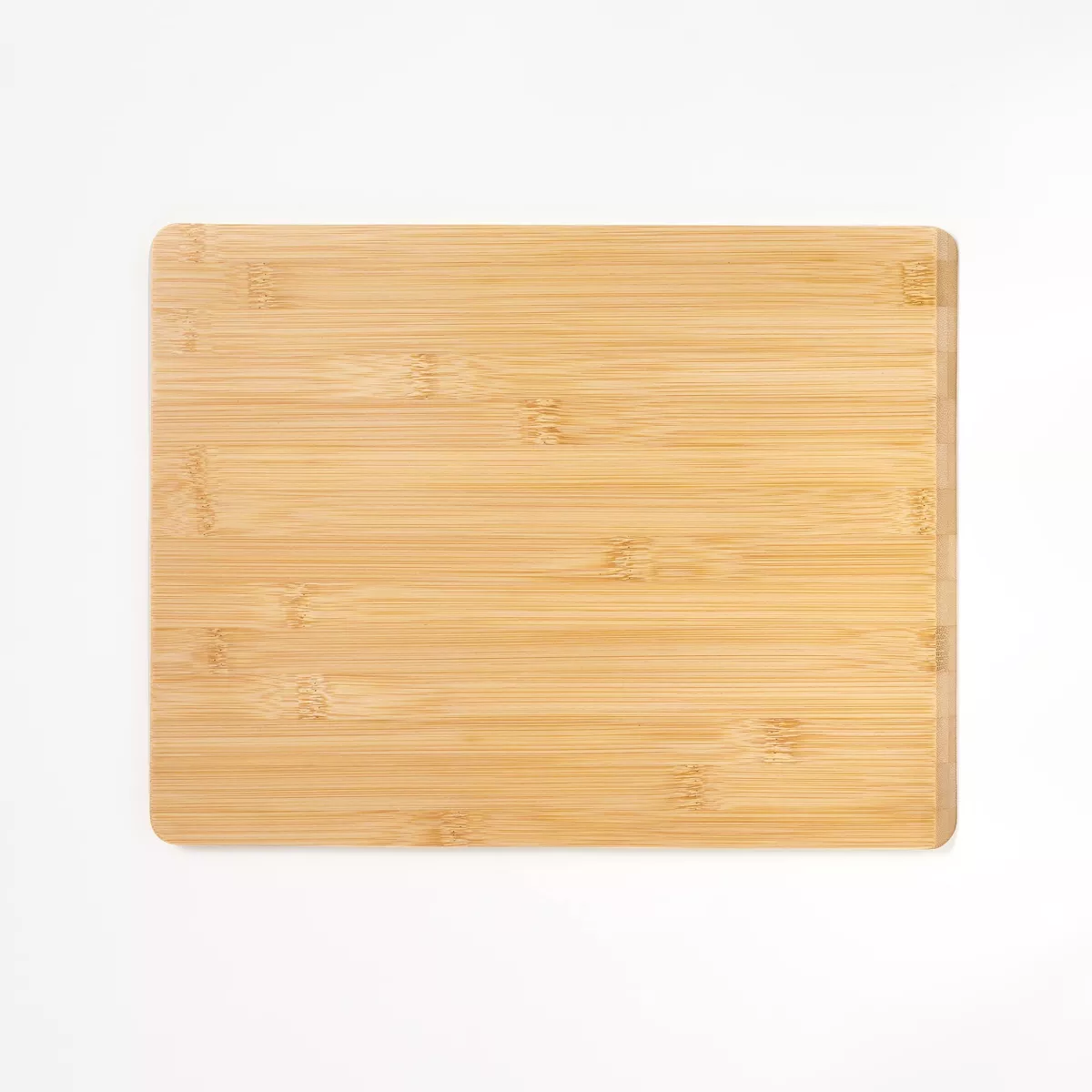 Figmint Reversible Bamboo Cutting Board with smooth surface, ideal for food preparation and serving, featuring a durable and eco-friendly design.
