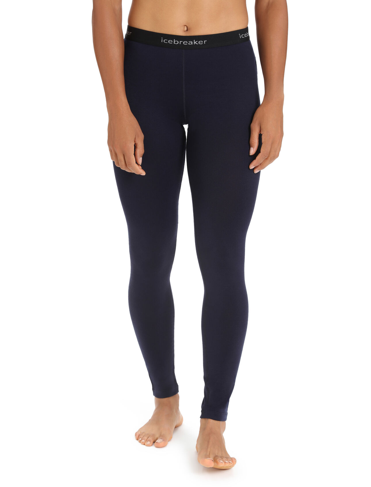 A woman wearing black 260 wool leggings from Icebreaker