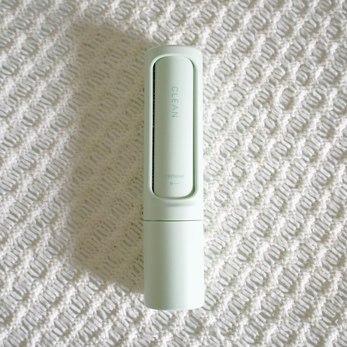 Gentle lint removal with Pastel Green Reusable Roller from Love of Earth Co.