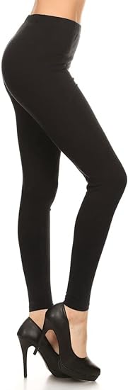 A woman wearing black cotton tights and black heels