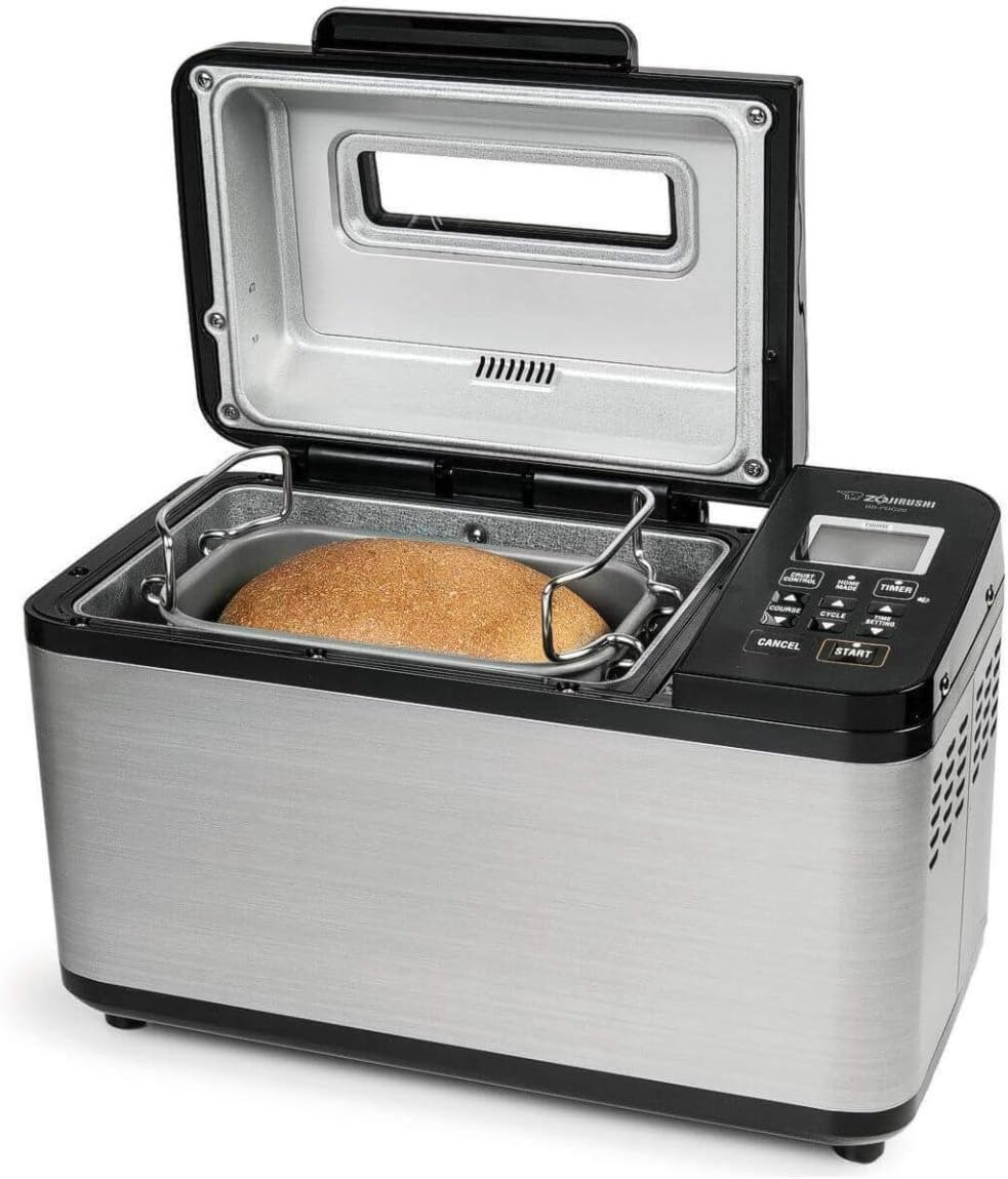 Zojirushi non-toxic bread machine baking fresh whole wheat loaf with stainless steel exterior.