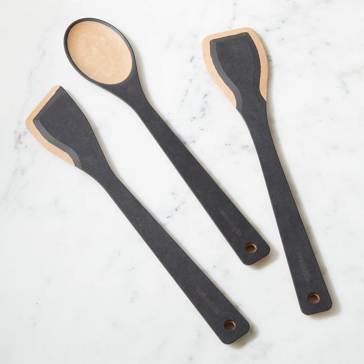 Durable non-toxic composite kitchen utensils with wooden accents, designed for safe, chemical-free cooking.