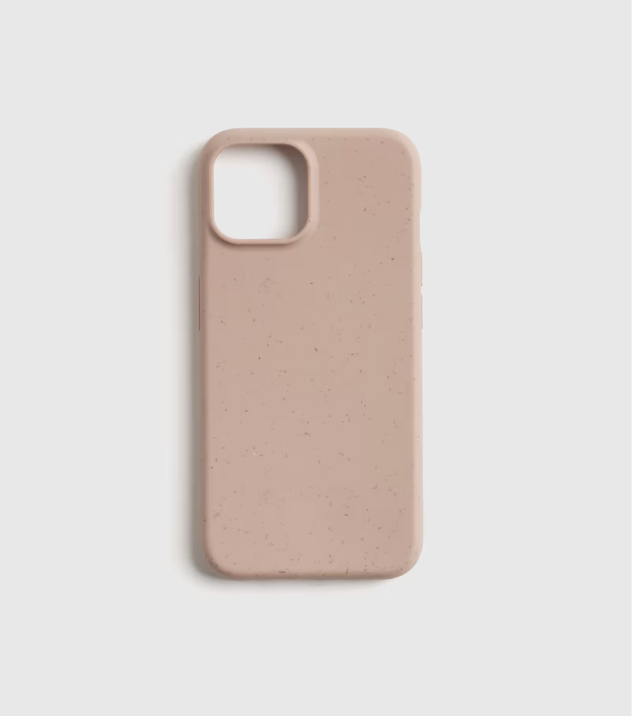 Minimalist biodegradable iPhone case in soft blush pink with a smooth matte finish and speckled texture.