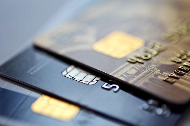 Three nonprofit credit cards over a grey background.